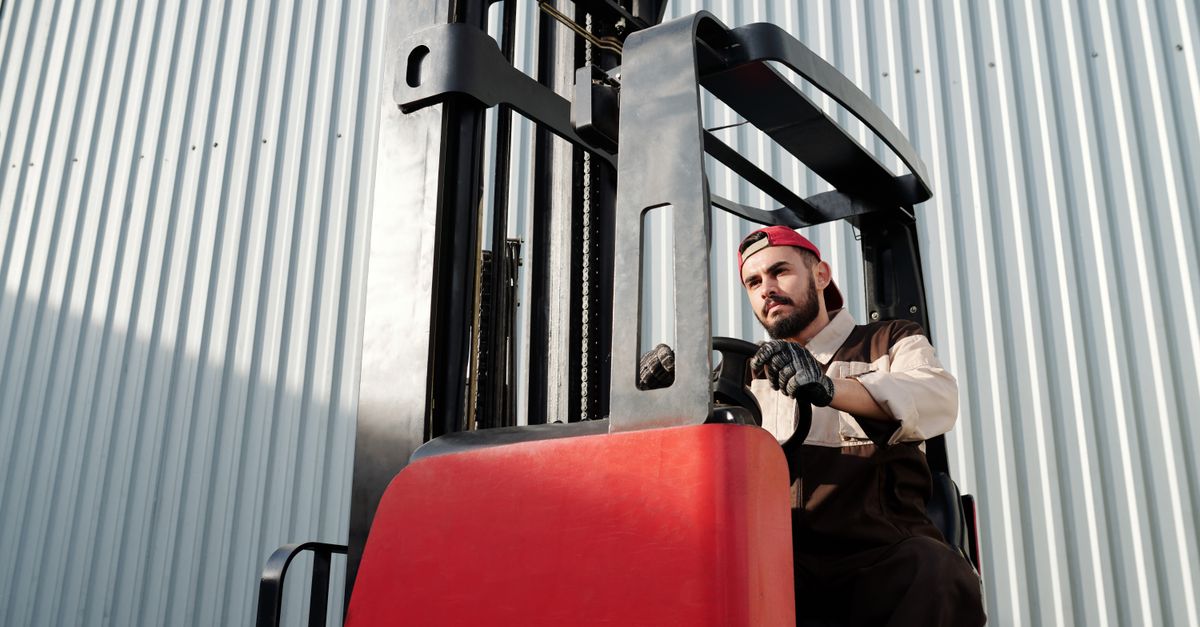 Forklift operator at work in a warehouse